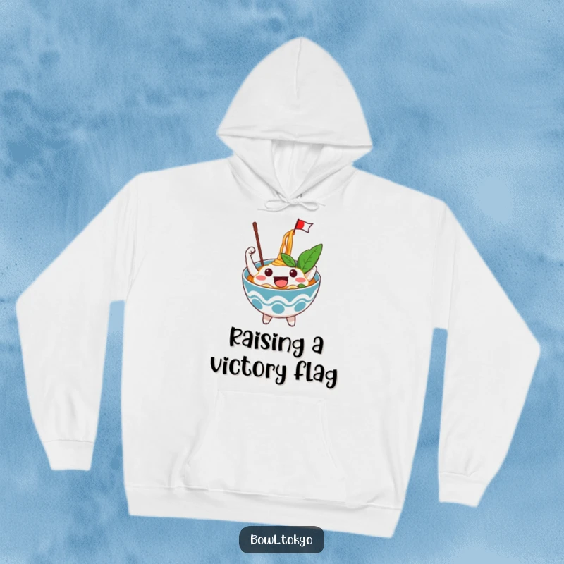 Funny Excited Ramen Bowl Hoodie featuring an enthusiastic character waving a flag from noodles, perfect for cozy and festive occasions.