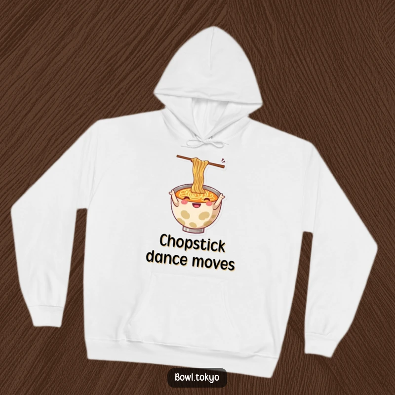Funny hoodie with a cheerful ramen bowl character energetically gesturing with wiggly chopsticks, radiating fun.