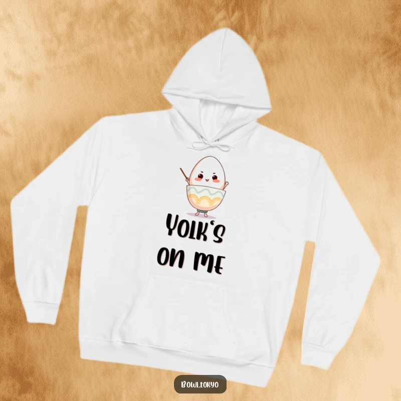 Funny Ramen Bowl Hoodie, a determined character balancing a giant egg, perfect for cozy motivation.
