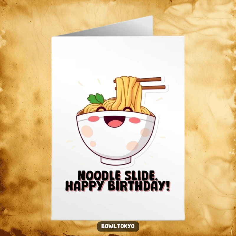 Funny Free Printable Birthday Card: Ramen bowl character with a big grin, joyfully sliding down a noodle.