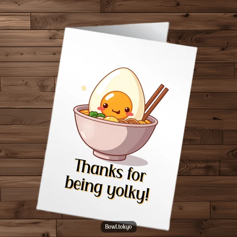 Funny free printable thank you card of a cute Kawaii ramen bowl character with a big, smiling egg peeking out warmly.