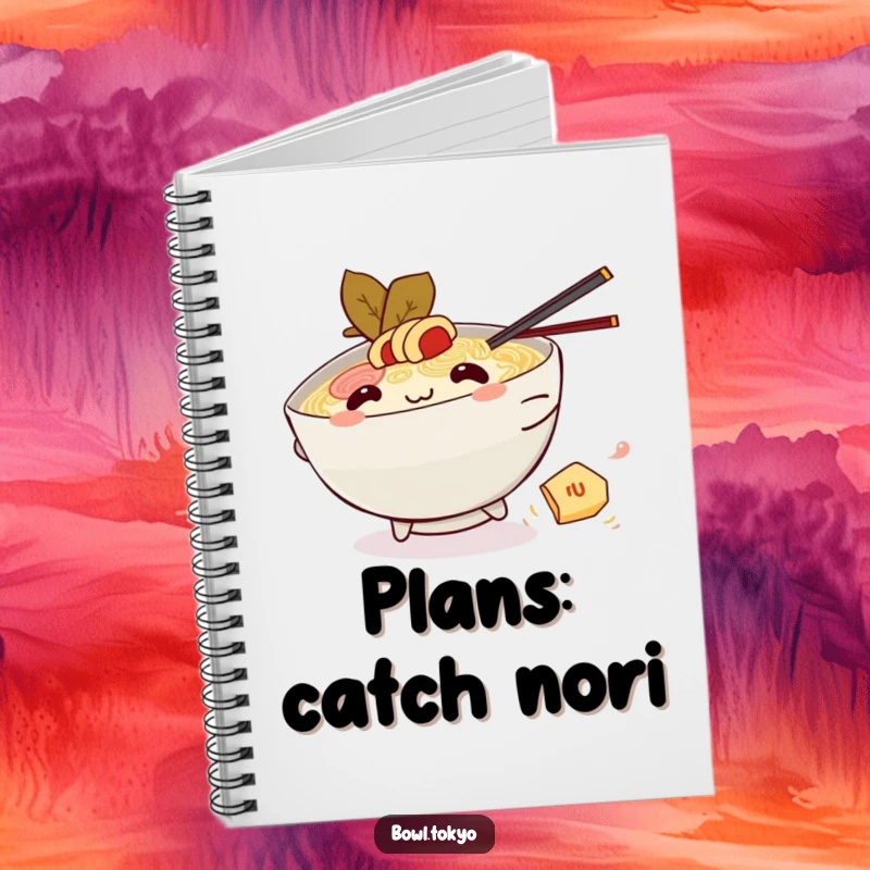 Funny Kawaii ramen bowl notebook, character chasing nori, playful design, foodie humor, stationery gift.