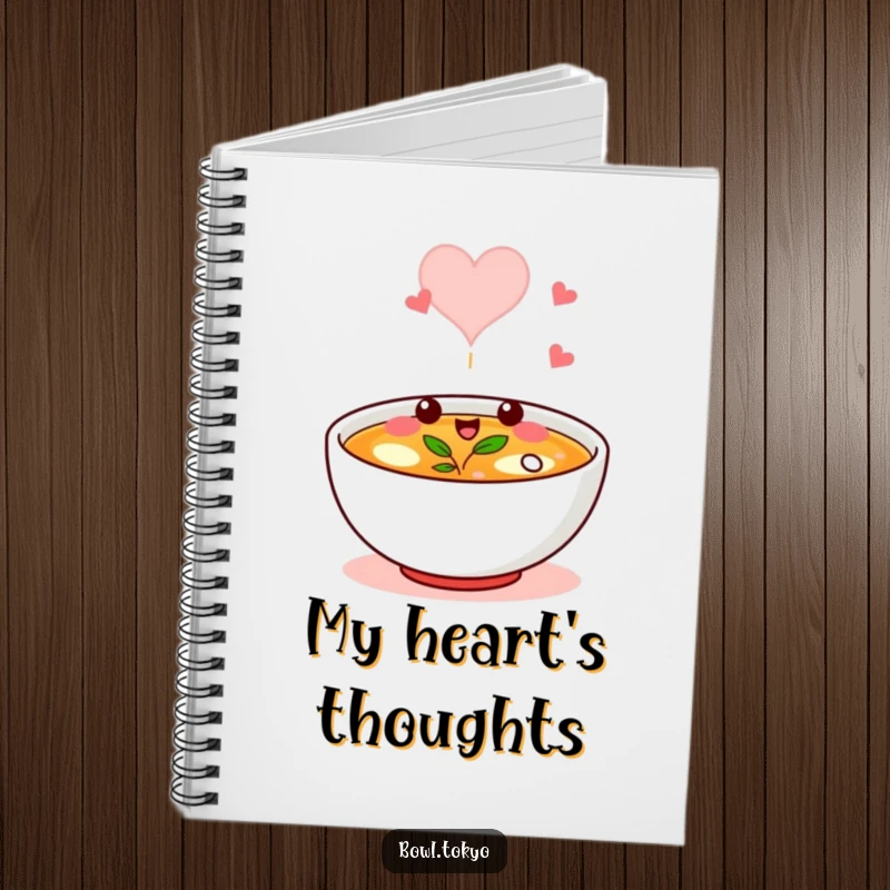 Funny notebook with a broth bowl character winking, its steam forming a heart, ideal for jotting ideas.