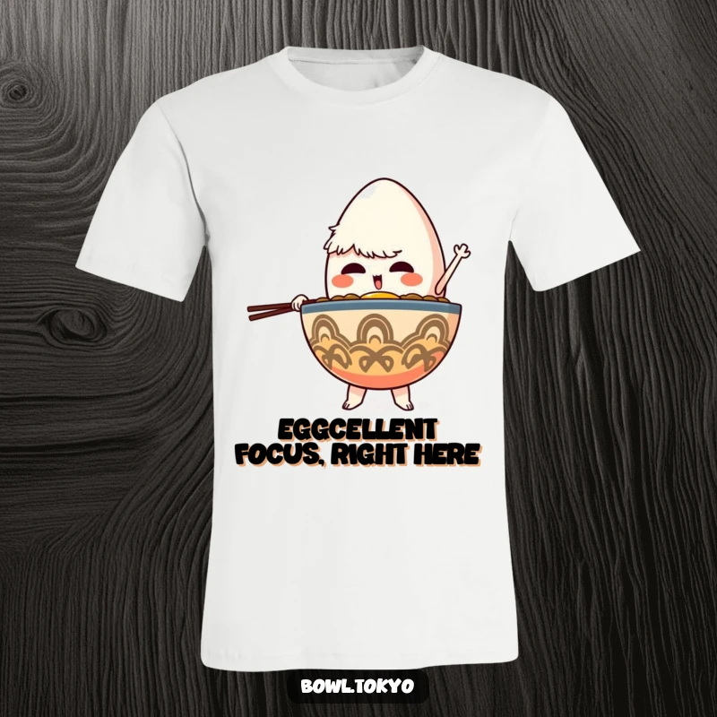 Funny Focused Ramen Bowl T-Shirt depicting a character determinedly balancing a giant egg, symbolizing focus and ambition.