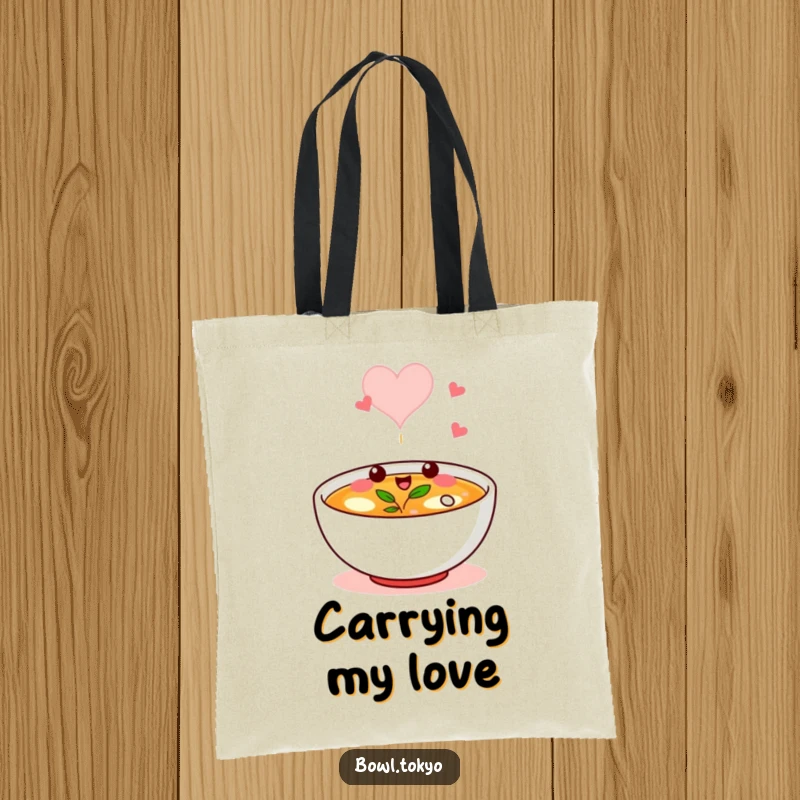 Funny tote bag showing a broth bowl character winking, its steam forming a heart, perfect for daily use.