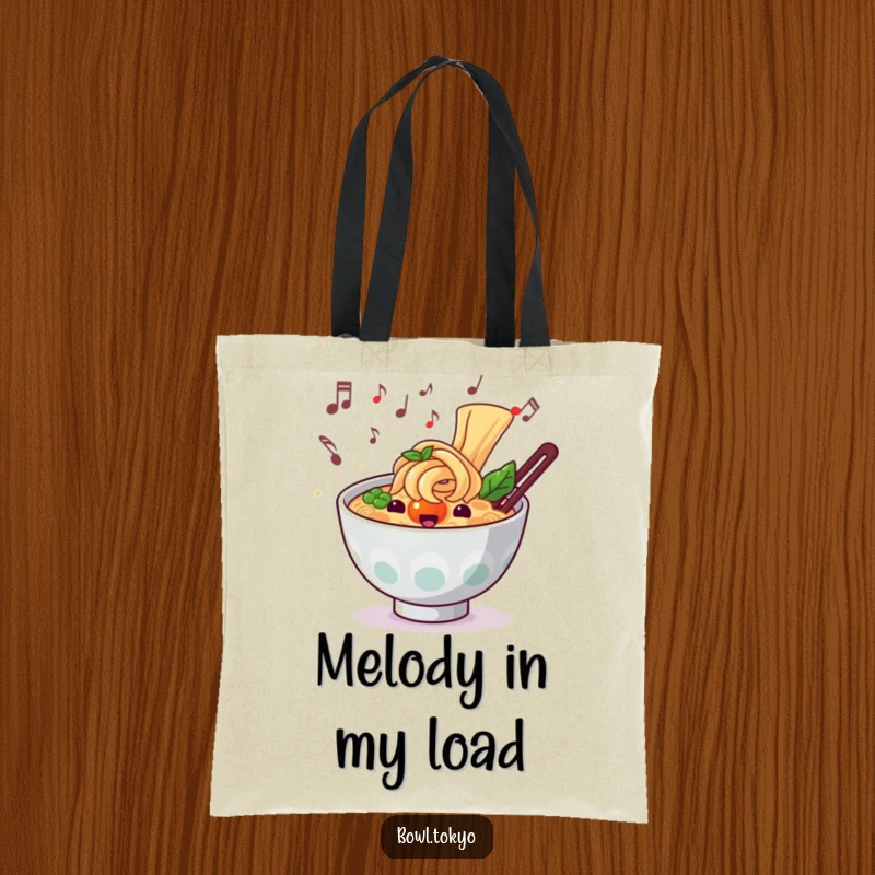Funny musical ramen tote bag depicting a noodle bowl character with musical notes, great for carrying essentials.